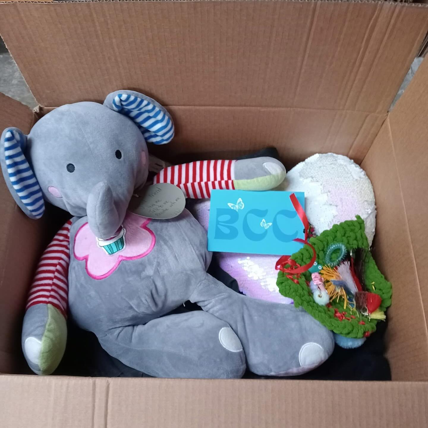 Baby care pack with soft toy elephant and essentials.