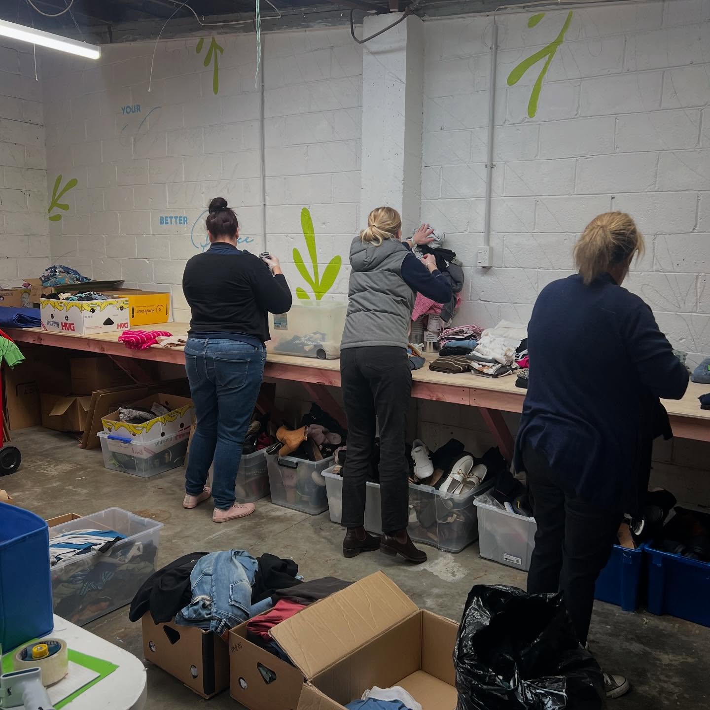 Volunteers sorting donations for Butterfly Compassion Community in Palmerston North.